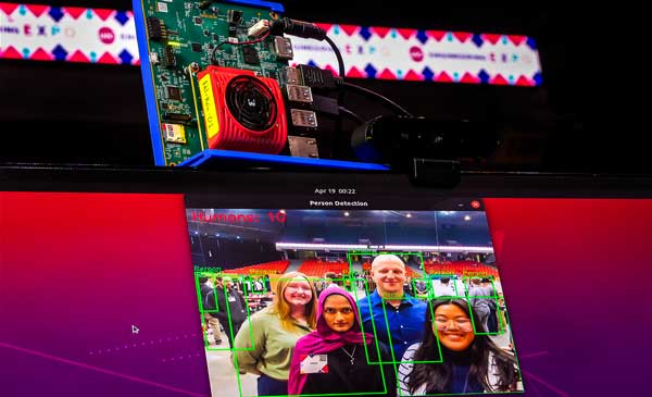 group of students are projected on a screen using a web camera